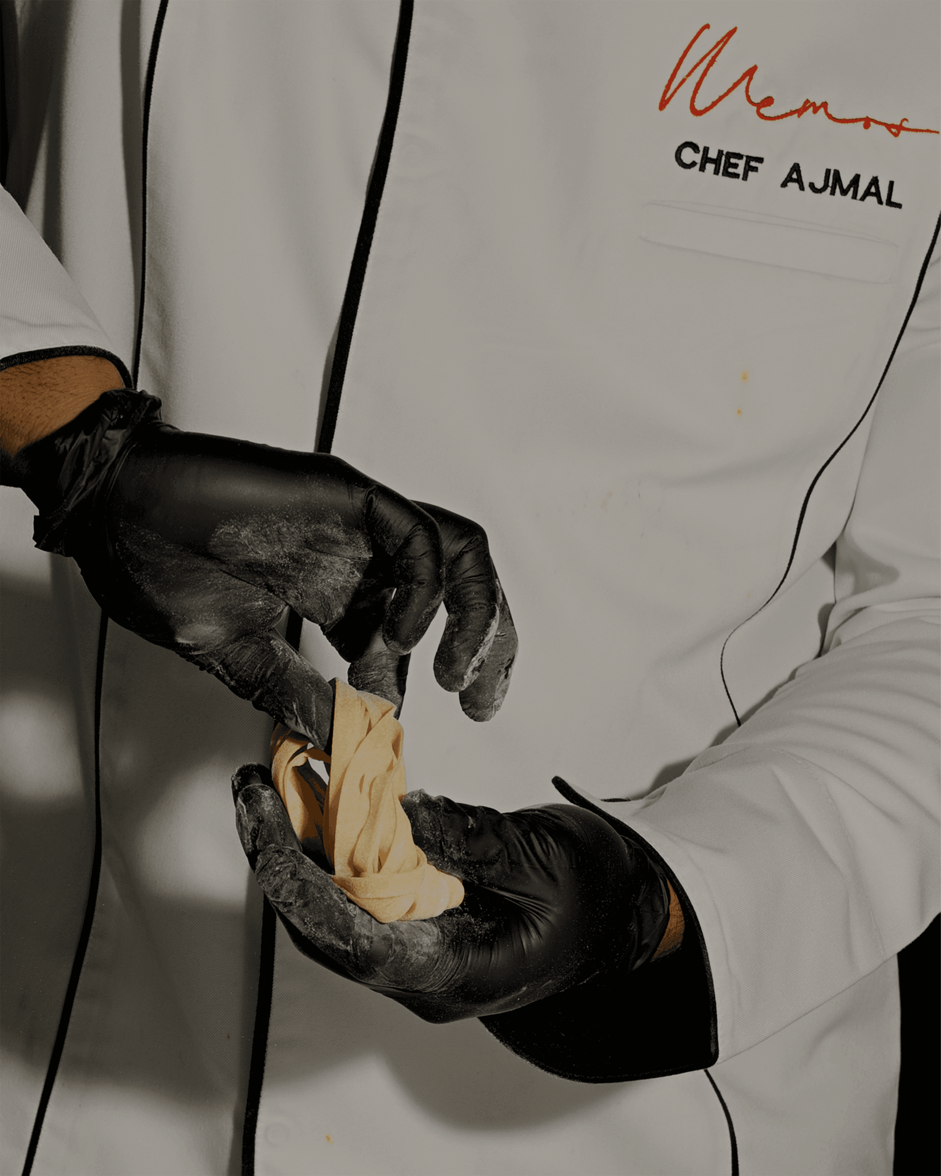 MEMOS chef hand-rolling fresh pasta dough